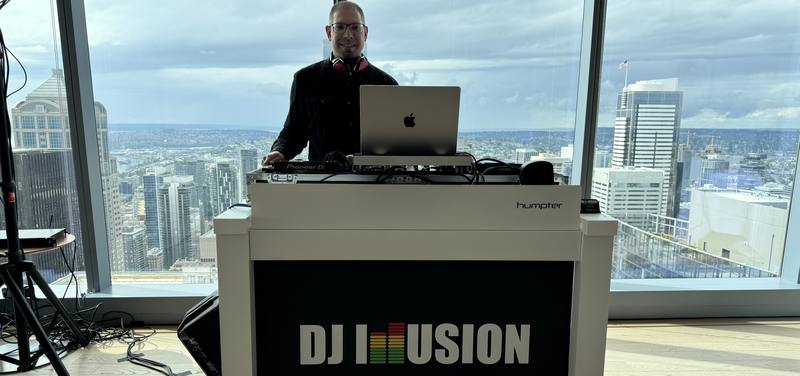 DJ Illusion at a Seattle graduation party with a downtown skyline view