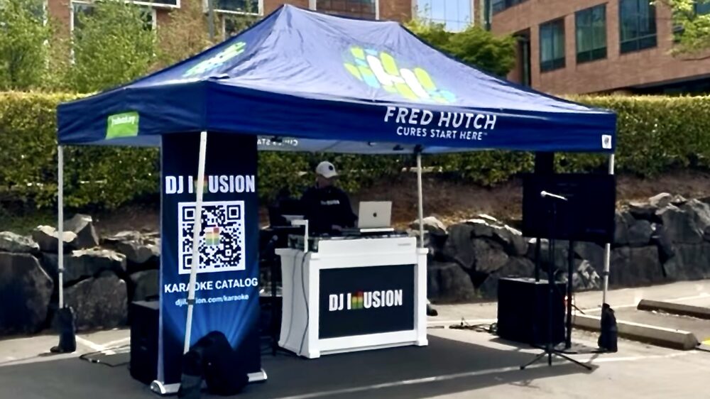DJ Illusion Sound Only corporate package with white aluminum DJ booth and RCF column speakers