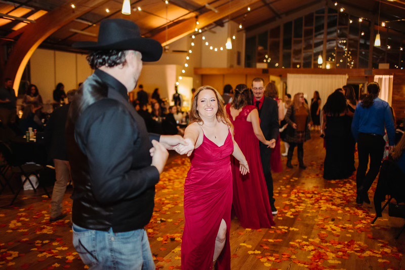 Adults dancing at a milestone birthday party with DJ Illusion club-style lighting in Seattle
