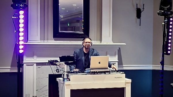 DJ Illusion Essential graduation package with lighting totems and haze on a packed dance floor