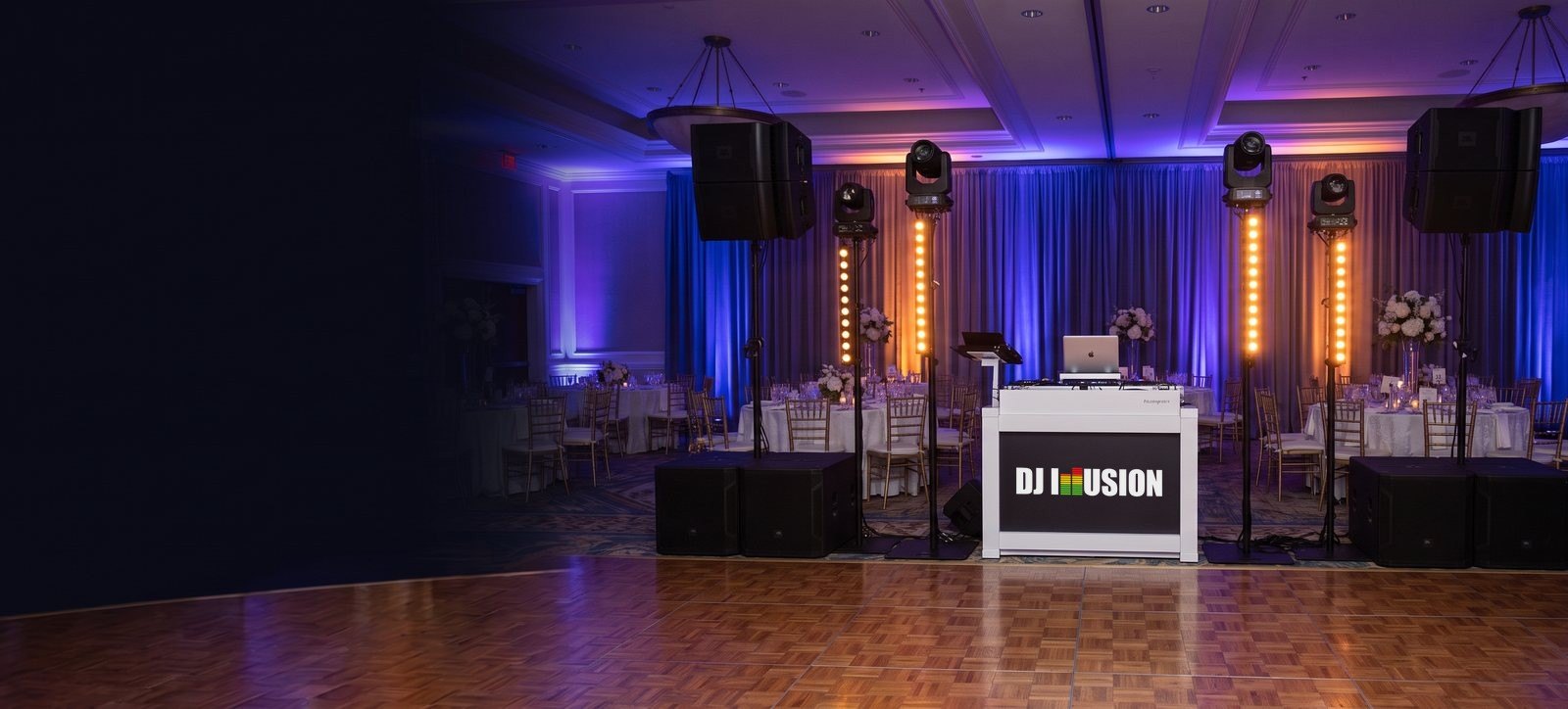 DJ Illusion booth and lighting set up in a Seattle event ballroom